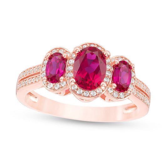 Oval Ruby and 0.25 CT. T.W. Natural Diamond Three Stone Frame Ring in Solid 10K Rose Gold