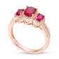 Oval Ruby and 0.25 CT. T.W. Natural Diamond Three Stone Frame Ring in Solid 10K Rose Gold