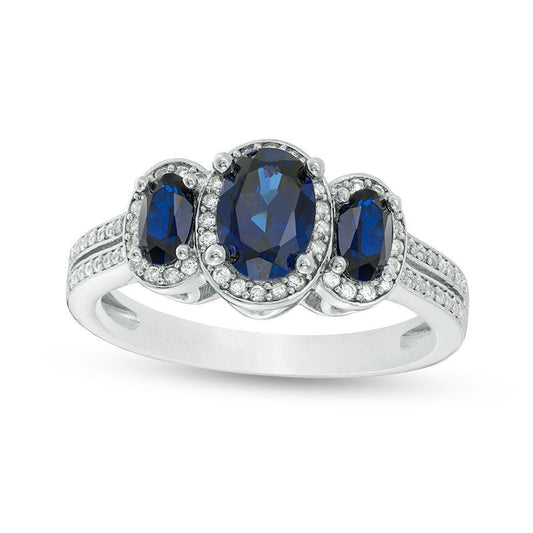 Oval Blue Sapphire and 0.25 CT. T.W. Natural Diamond Three Stone Frame Ring in Solid 10K White Gold