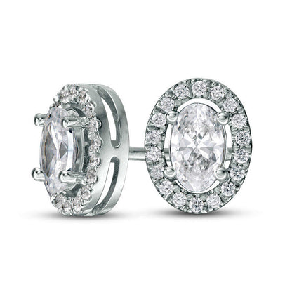 0.5 CT. T.W. Certified Oval Diamond Frame Stud Earrings in 14K White Gold (I/I1)
