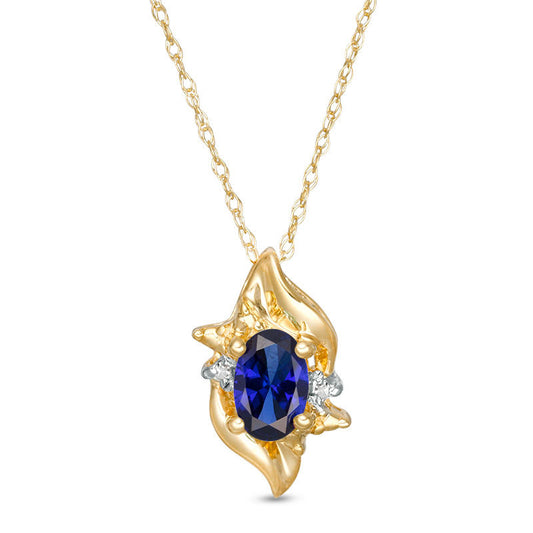 Oval Lab-Created Blue Sapphire and Diamond Accent Flame Burst Pendant in 10K Yellow Gold