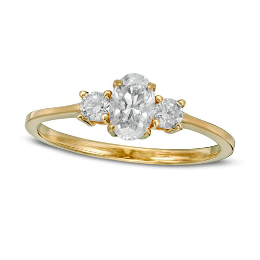 0.63 CT. T.W. Oval and Round Natural Diamond Three Stone Engagement Ring in Solid 14K Gold
