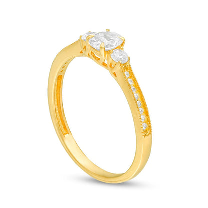 0.63 CT. T.W. Oval and Round Natural Diamond Three Stone Engagement Ring in Solid 14K Gold