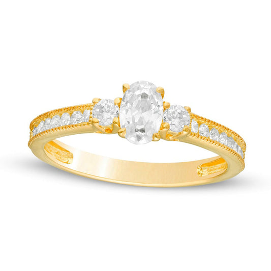 0.88 CT. T.W. Oval and Round Natural Diamond Three Stone Engagement Ring in Solid 14K Gold