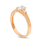 0.63 CT. T.W. Oval and Round Natural Diamond Three Stone Engagement Ring in Solid 14K Rose Gold