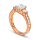 1.75 CT. T.W. Oval and Round Natural Diamond Three Stone Engagement Ring in Solid 14K Rose Gold