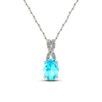 Oval Aquamarine and 0.05 CT. T.W. Natural Diamond "X" Drop Pendant in 10K White Gold