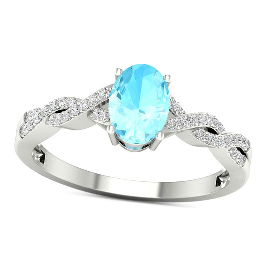 Oval Aquamarine and 0.10 CT. T.W. Natural Diamond Twist Shank Ring in Solid 10K White Gold
