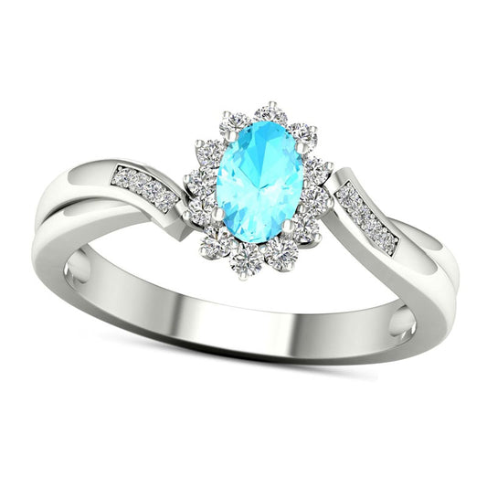 Oval Aquamarine and 0.13 CT. T.W. Natural Diamond Sunburst Frame Twist Shank Ring in Solid 10K White Gold
