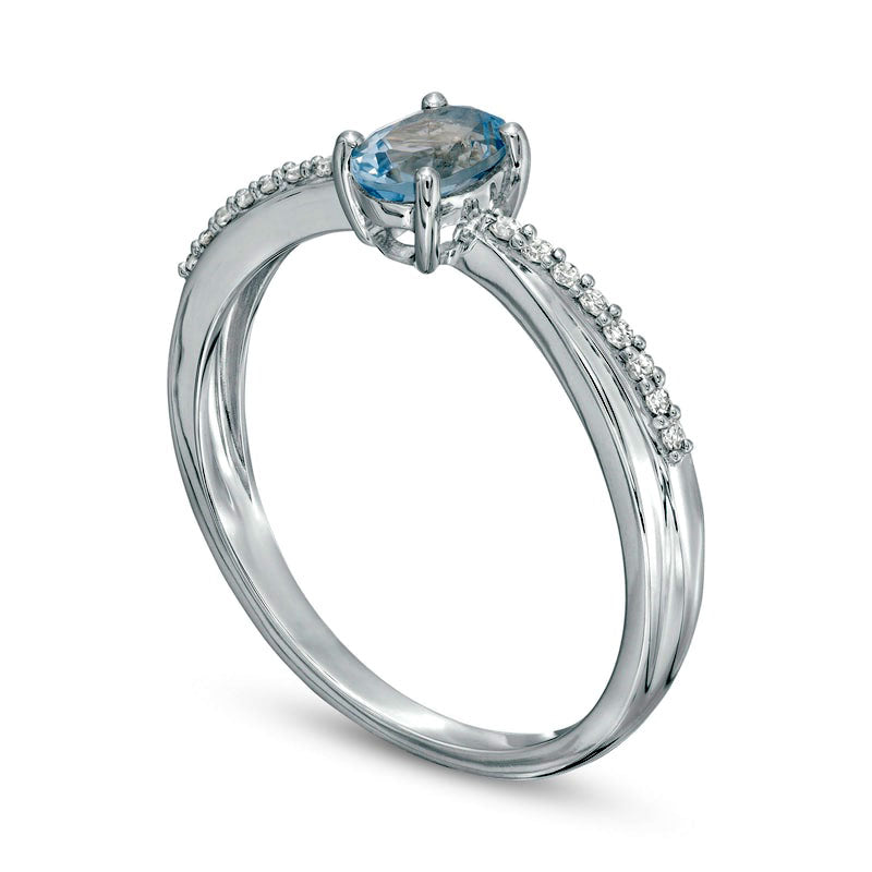 Oval Aquamarine and 0.07 CT. T.W. Natural Diamond Criss-Cross Ring in Solid 10K White Gold