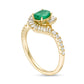 Oval Emerald and 0.38 CT. T.W. Natural Diamond Frame Bypass Ring in Solid 10K Yellow Gold