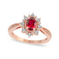 Oval Ruby and 0.10 CT. T.W. Natural Diamond Sunburst Frame Antique Vintage-Style Tapered Shank Ring in Solid 10K Rose Gold