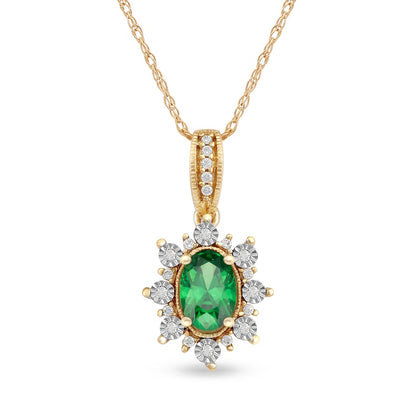 Oval Emerald and 0.07 CT. T.W. Natural Diamond Sunburst Frame Antique Vintage-Style Drop Pendant in 10K Yellow Gold