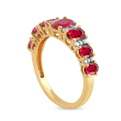 Oval Ruby and 0.17 CT. T.W. Natural Diamond Graduated Seven Stone Alternating Trios Ring in Solid 10K Yellow Gold