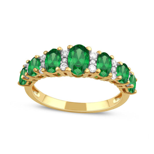 Oval Emerald and 0.17 CT. T.W. Natural Diamond Graduated Seven Stone Alternating Trios Ring in Solid 10K Yellow Gold