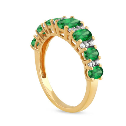 Oval Emerald and 0.17 CT. T.W. Natural Diamond Graduated Seven Stone Alternating Trios Ring in Solid 10K Yellow Gold