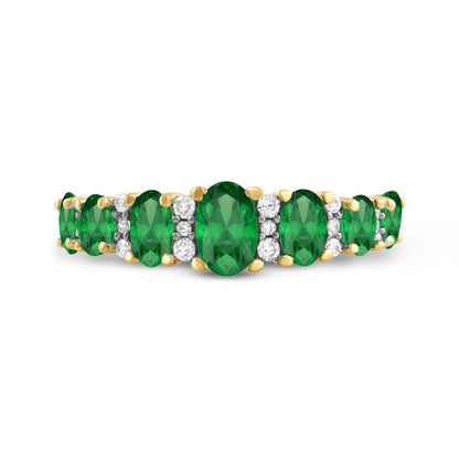 Oval Emerald and 0.17 CT. T.W. Natural Diamond Graduated Seven Stone Alternating Trios Ring in Solid 10K Yellow Gold