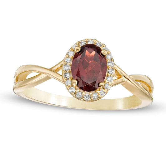 Oval Garnet and 0.07 CT. T.W. Natural Diamond Frame Twist Shank Ring in Solid 10K Yellow Gold