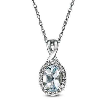 Oval Aquamarine and 0.07 CT. T.W. Natural Diamond Frame Pendant in 10K White Gold