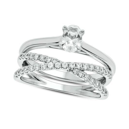 0.75 CT. T.W. Oval Natural Diamond Crossover Bridal Engagement Ring Set in Solid 10K White Gold