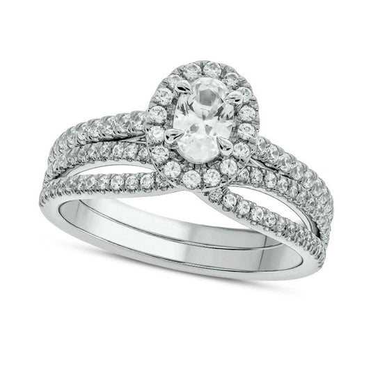 1.0 CT. T.W. Oval Natural Diamond Frame Crossover Bridal Engagement Ring Set in Solid 10K White Gold