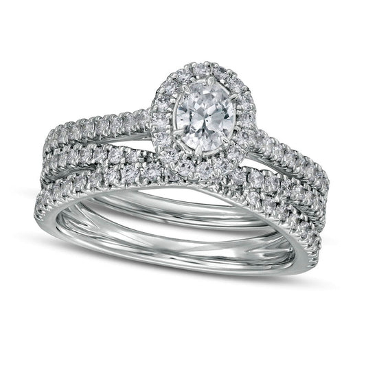 1.0 CT. T.W. Oval Natural Diamond Frame Crossover Bridal Engagement Ring Set in Solid 14K White Gold