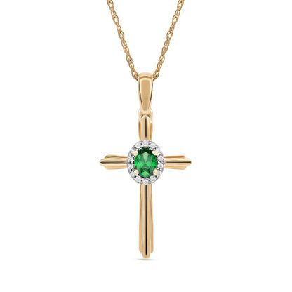 Oval Emerald and 0.05 CT. T.W. Natural Diamond Frame Layered Cross Pendant in 10K Yellow Gold