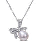 8.5-9.0mm Oval Cultured Freshwater Pearl and Natural Diamond Accent Bow Pendant in Sterling Silver