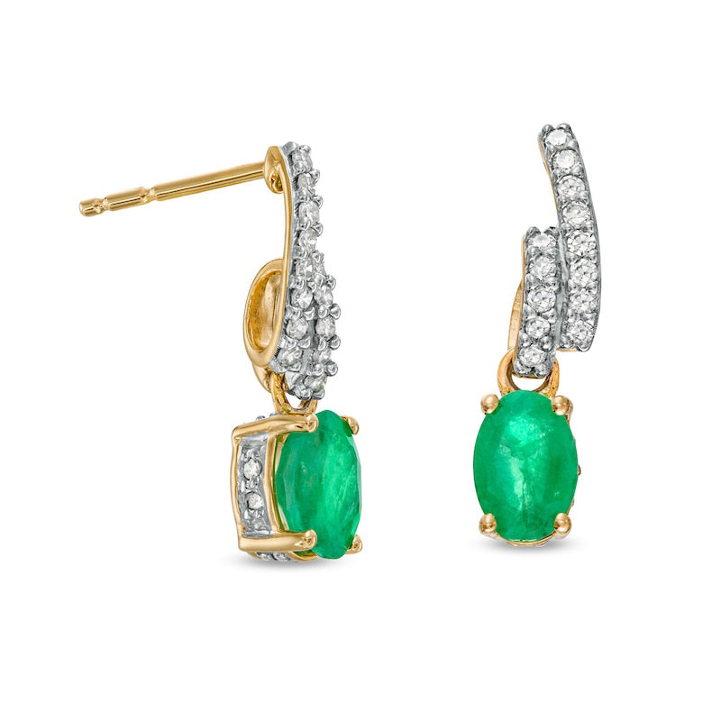 Oval Emerald and 0.17 CT. T.W. Diamond Bypass Ribbon Loop Drop Earrings in 10K Gold