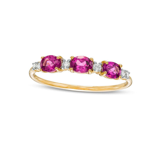 Sideways Oval Rhodolite and 0.07 CT. T.W. Natural Diamond Three Stone Ring in Solid 10K Yellow Gold