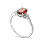 Oval Garnet and 0.10 CT. T.W. Natural Diamond Leaf-Sides Floral Ring in Solid 10K White Gold