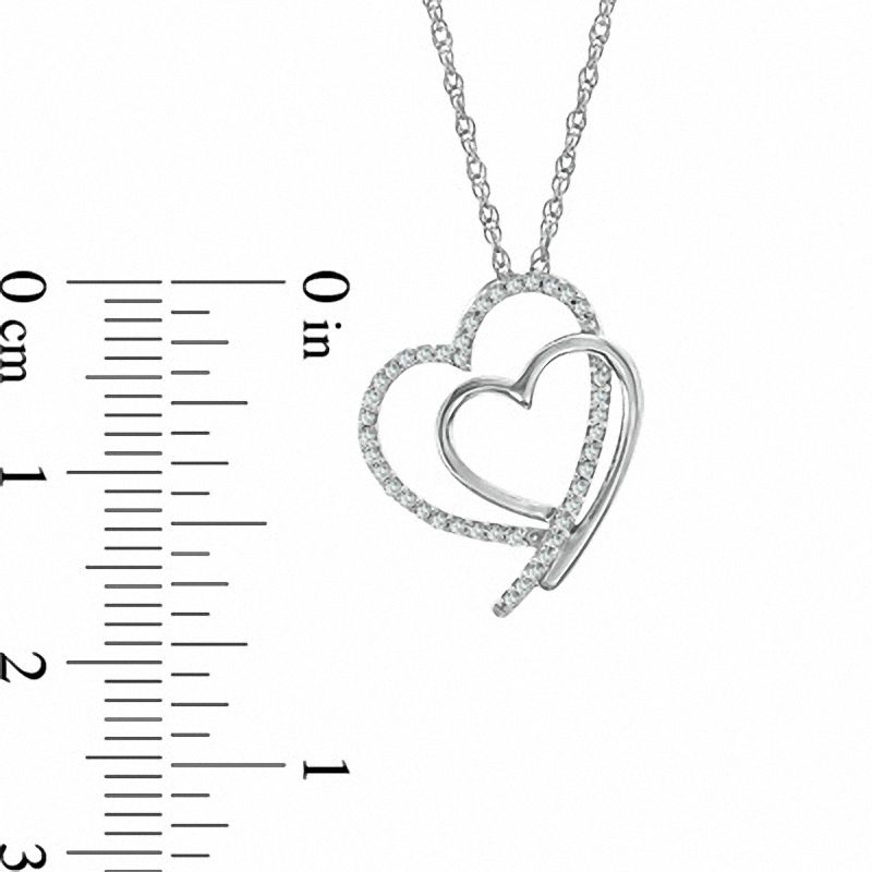 0.13 CT. T.W. Natural Diamond Shadowed Tilted Heart Pendant in Sterling Silver