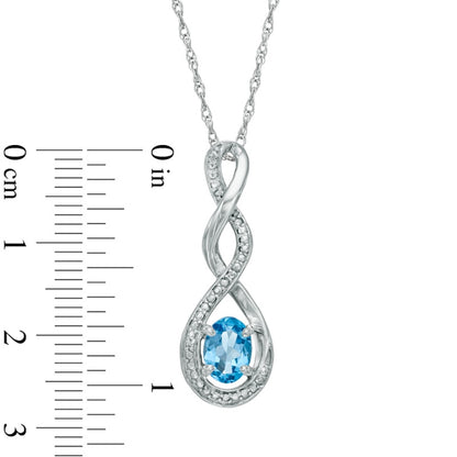 Oval Blue Topaz and Natural Diamond Accent Infinity Twist Pendant in Sterling Silver