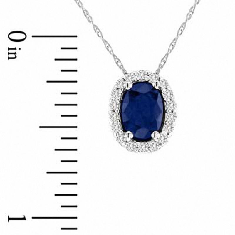 Oval Blue Sapphire and 0.17 CT. T.W. Natural Diamond Pendant in 14K White Gold