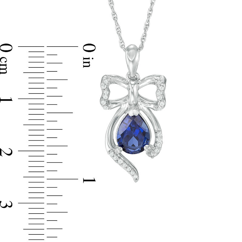 Pear-Shaped Lab-Created Blue Sapphire and 0.1 CT. T.W. Diamond Bow Pendant in Sterling Silver