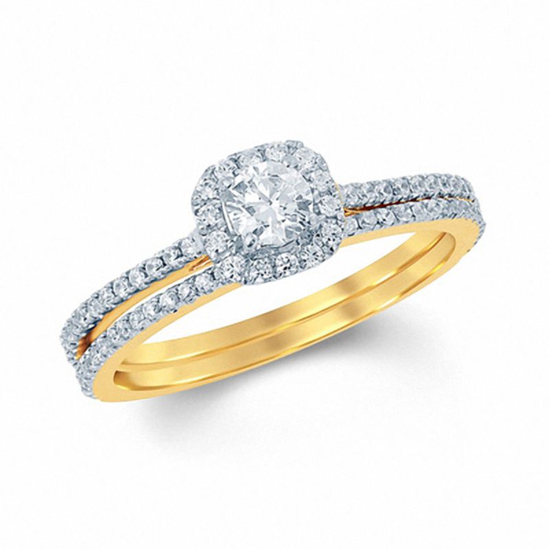 5/8 CT. T.W. Diamond Cushion Halo Bridal Engagement Ring Set in 14K Gold