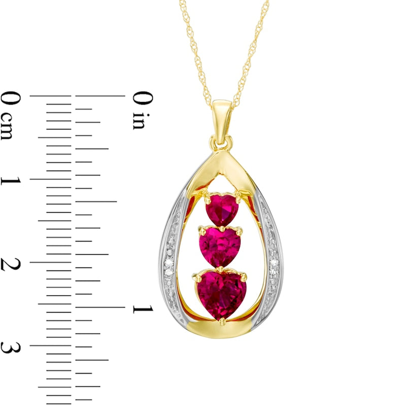 Heart-Shaped Lab-Created Ruby and Diamond Accent Linear Three Stone Pendant in 10K Yellow Gold