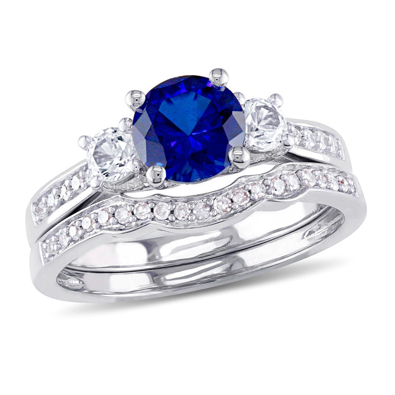 6.0mm Lab-Created Blue and White Sapphire with 1/8 CT. T.W. Diamond Three Stone Bridal Engagement Ring Set in 14K White Gold