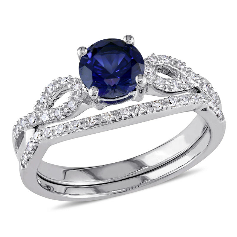 6.0mm Lab-Created Blue Sapphire and 1/8 CT. T.W. Diamond Twist Shank Bridal Engagement Ring Set in 14K White Gold