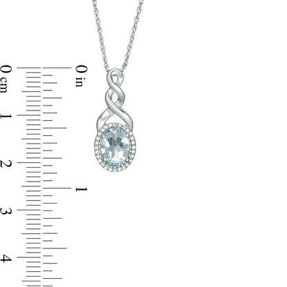 Oval Aquamarine and Natural Diamond Accent Frame Twist Pendant in Sterling Silver