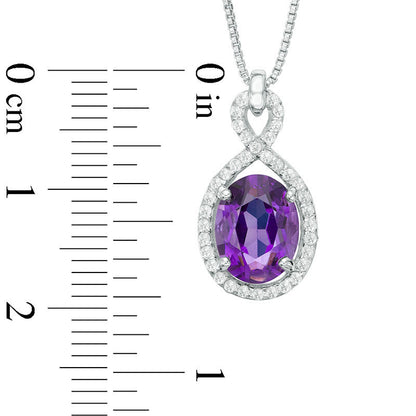 Oval Amethyst and White Topaz Frame Pendant in Sterling Silver
