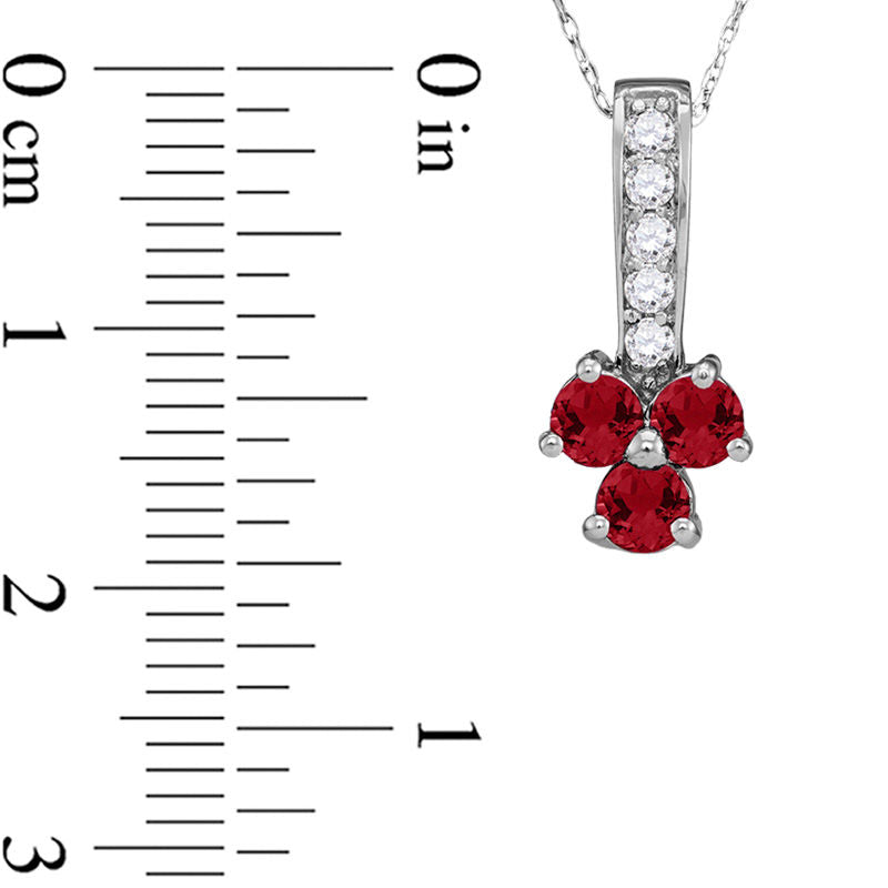 Lab-Created Ruby and 0.13 CT. T.W. Diamond Trio Pendant in Sterling Silver