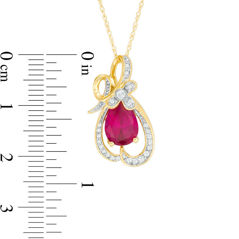 Pear-Shaped Lab-Created Ruby and 0.13 CT. T.W. Diamond Antique Vintage-Style Looping Ribbon Pendant in 10K Yellow Gold
