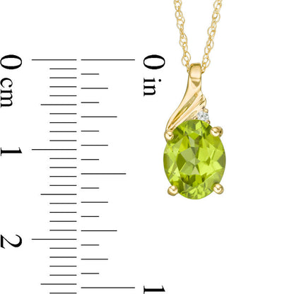 Oval Peridot and Natural Diamond Accent Swirl Top Pendant in 10K Yellow Gold