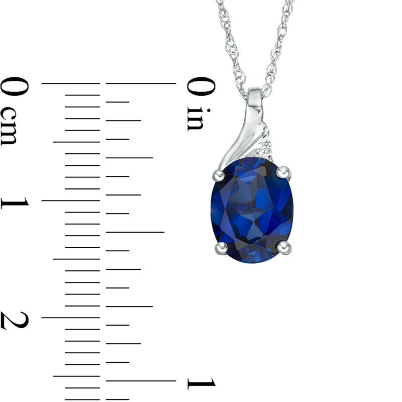 Oval Lab-Created Blue Sapphire and Diamond Accent Swirl Top Pendant in 10K White Gold
