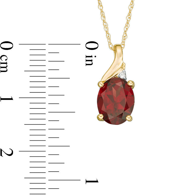Oval Garnet and Natural Diamond Accent Swirl Top Pendant in 10K Yellow Gold