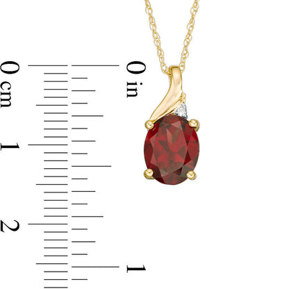 Oval Garnet and Natural Diamond Accent Swirl Top Pendant in 10K Yellow Gold