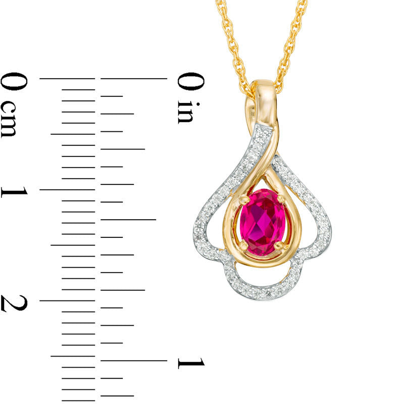Oval Lab-Created Ruby and 0.17 CT. T.W. Diamond Teardrop Frame Leaf Pendant in 10K White, Yellow or Rose Gold