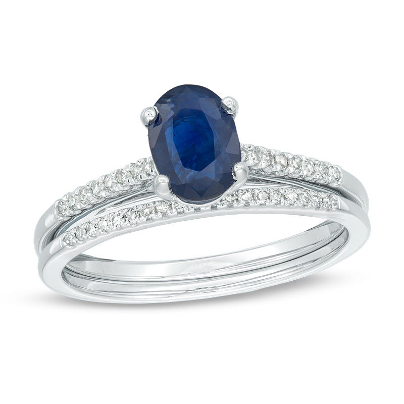 Oval-Shaped Blue Sapphire and 1/8 CT. T.W. Diamond Bridal Engagement Ring Set in 14K White Gold