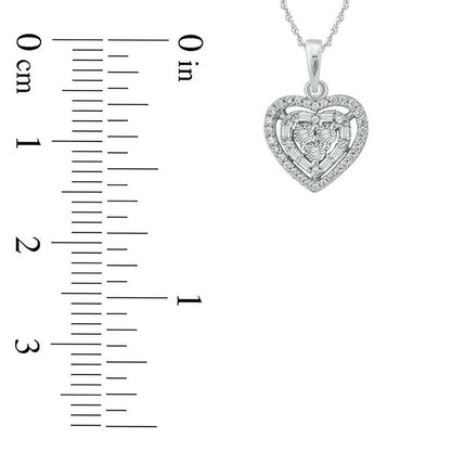 0.17 CT. T.W. Baguette and Round Natural Diamond Heart Frame Pendant in 10K White Gold